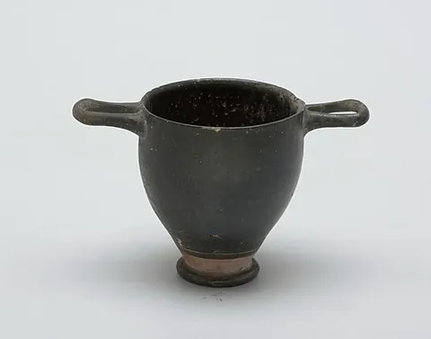 scyphus: a kind of large drinking cup used in Ancient Greece and Ancient Rome, especially by poor people