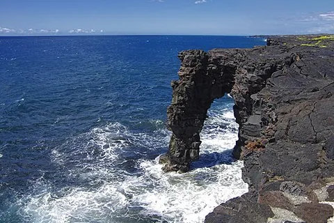 sea arch: an opening through a headland, leaving a bridge of rock over the water