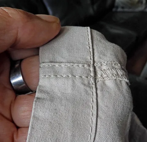 seam: a folded-back and stitched piece of fabric; especially, the stitching that joins two or more pieces...