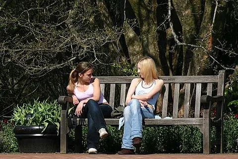 seatmate: one who shares a seat (such as a bench or other surface that seats more than one)