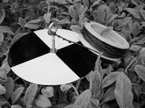 secchi disk: a circular disk used to measure water transparency (and thus turbidity)