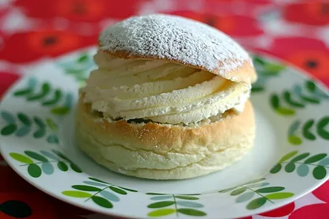semla: a pastry with a cream and almond paste filling, traditionally eaten on Shrove Tuesday in Sweden,...