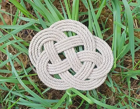 sennit: braided cord or fabric of such small stuff as plaited rope yarns