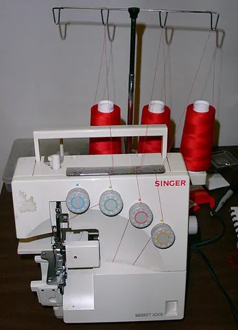 serger: a type of sewing machine designed to produce an overlock stitch and to cut the fabric as it stitches