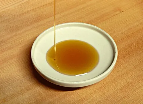 sesame oil: oil extracted from sesame seeds (often after roasting) and used to flavor foods