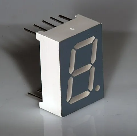 seven-segment: of an electronic device or display: consisting of three horizontal and four vertical lines, in an...