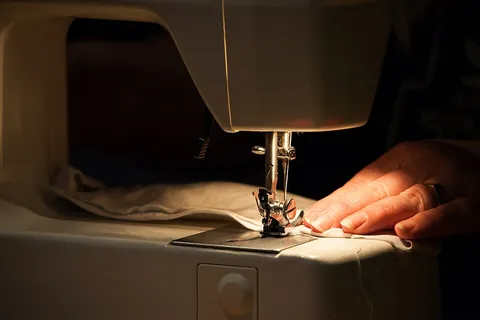 sew: to use a needle to pass thread repeatedly through (pieces of fabric) in order to join them together