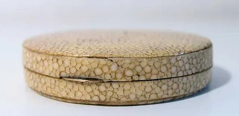 shagreen: an untanned leather, often dyed green; originally made from horse skin, today mostly made from the...
