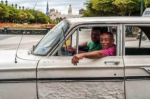 shared taxi: a vehicle for hire, typically smaller than a bus, taking passengers on a fixed or semi-fixed route...