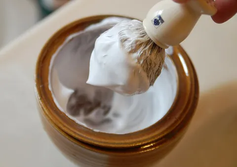 shaving cream: a substance, usually a foam or gel, that is applied to the face or wherever else hair grows, to...