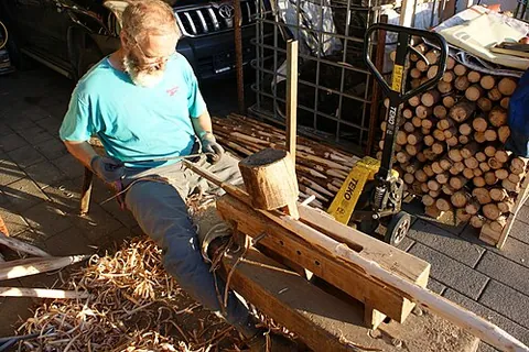 shaving horse: a device that allows a woodworker to sit astride it while it clamps onto a piece of wood which is...