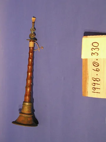 shawm: a mediaeval double-reed wind instrument with a conical wooden body