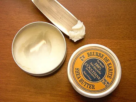 shea butter: a slightly yellowish or ivory-colored natural fat extracted from fruit of the shea tree (Vitellaria...