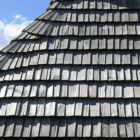 shingle: a small, thin piece of building material, often with one end thicker than the other, for laying in...