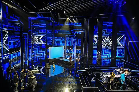 shiny-floor: highly produced, extravagant, and spectacular in a tightly-controlled, somewhat formulaic way