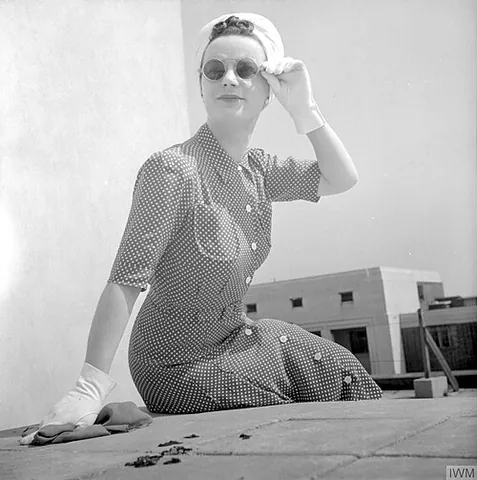 shirtdress: a type of dress, borrowing details, such as a collar or button front, from a man's shirt