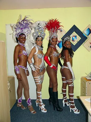 showgirl: a female performer in any of various (usually live) entertainment roles, usually including dancing...