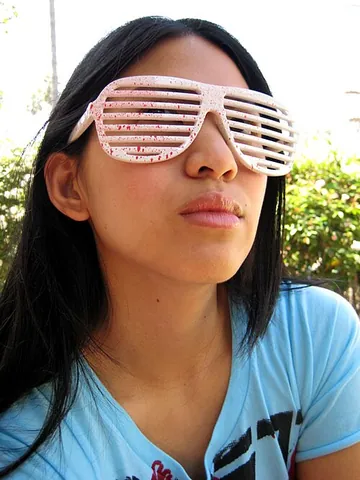shutter shades: a style of sunglasses which have frames containing horizontal slats as opposed to tinted lenses