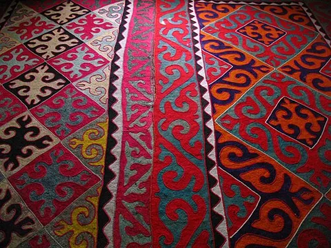 shyrdak: a colourful stitched felt rug, traditionally hand-made in Central Asia