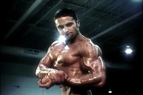 side chest: a standard pose in which one arm is bent at the elbow, and the chest muscles are flexed, with one's...