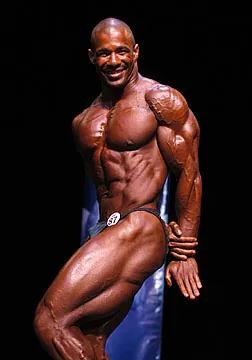 side triceps: a standard pose in which one arm is held straight with the triceps flexed, with one's side turned...