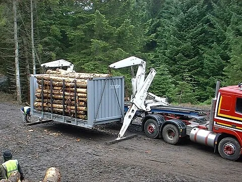 sidelifter: a specialized vehicle or semi-trailer used to hoist and transport intermodal containers, loaded...
