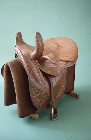 sidesaddle: a saddle, usually for a woman, in which the rider sits with both legs on the same side of the horse