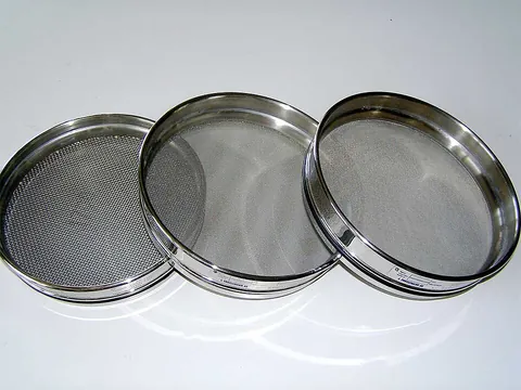 sifter: a tool for sifting, especially one for powdered cooking ingredients