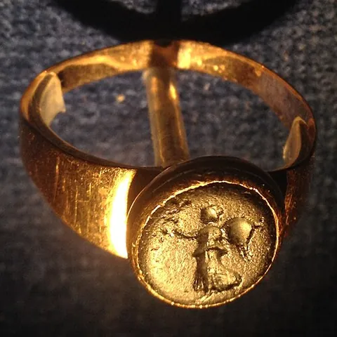 signet ring: a finger ring bearing a signet, seal or coat of arms