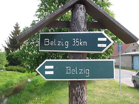 signpost: a post bearing a sign that gives information on directions