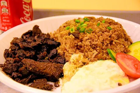 silog: a class of Filipino breakfast dishes containing garlic fried rice and fried egg, sunny side up,...