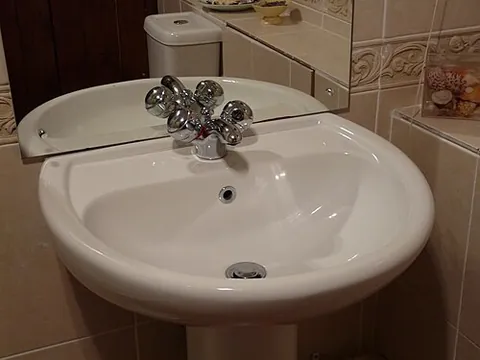 sink: to descend or submerge (or to cause to do so) into a liquid or similar substance