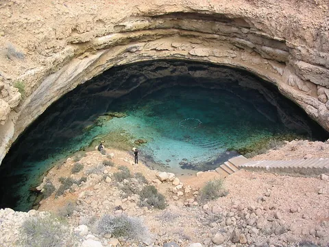 sinkhole: a hole formed in soluble rock by the action of water, serving to conduct surface water to an...