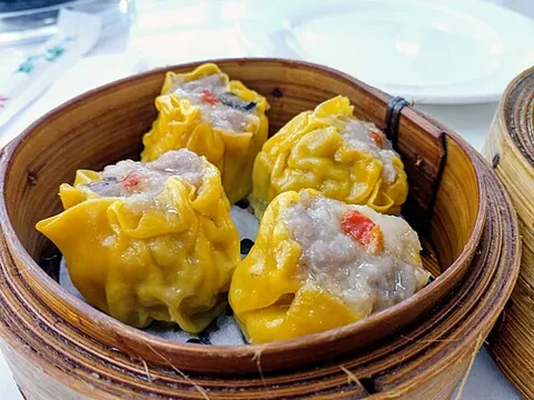 siomai: a traditional steamed Chinese pork dumpling served as part of the dim sum menu
