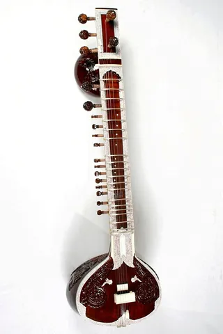 sitar: a Hindustani/Indian classical stringed instrument, typically having a gourd as its resonating...