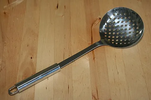 skimmer: a sieve-like, slotted spoon