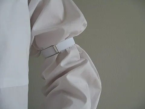 sleeve garter: a garter worn on the sleeve of a shirt above the elbow to hold the lower part of the sleeve tight...