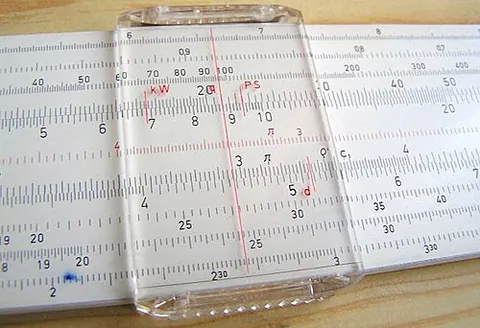 slide rule: an analog calculator consisting of three interlocking strips marked with logarithmic scales, such...
