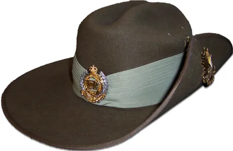 slouch hat: a broad-brimmed felt hat worn by soldiers, often with a clasp on the left side to allow a rifle to...