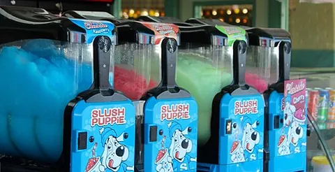 slush puppie: a slushie, a slush, a nonalcoholic drink made of small ice crystals flavored with syrup