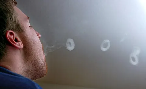 smoke ring: a vortex ring of smoke; typically one exhaled by a smoker