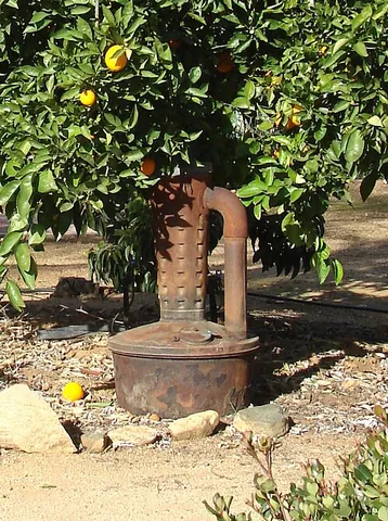smudge pot: a set of kerosene flares with round bottoms and wicks in a protected cage, once used to mark...