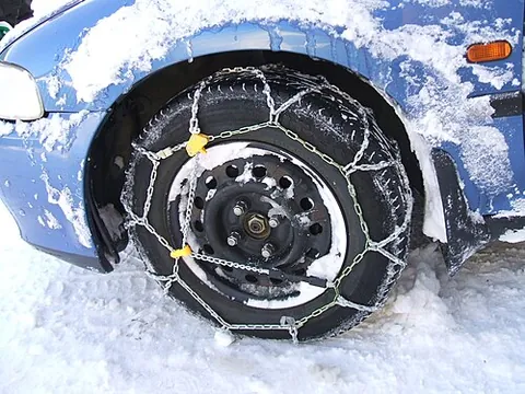 snow chain: a chain put on a wheel of a vehicle to give it more traction