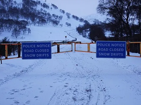 snow gate: a gate on a road in a mountainous area which is closed when the road is blocked by snow