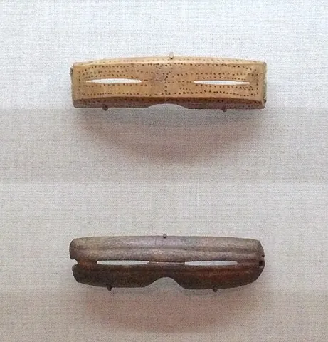 snow goggles: traditional eyewear used to prevent snow blindness, often formed of a piece of driftwood or bone...