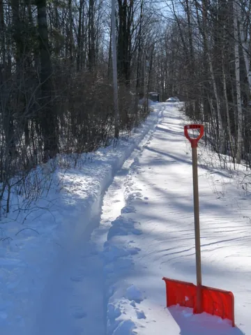 snow shovel: a broad-bladed shovel designed specifically for the shovelling of snow