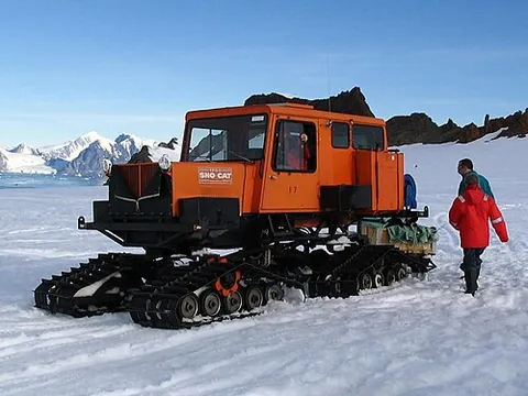 snowcat: a truck-like enclosed vehicle on tracks, designed to move on snow