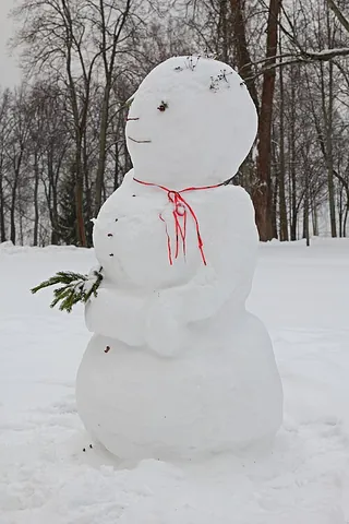 snowman: a humanoid figure made with large snowballs stacked on each other. Human traits like a face and...