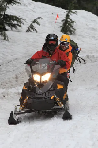 snowmobile: a vehicle with skis at the front and a caterpillar track at the rear, used for travelling over...