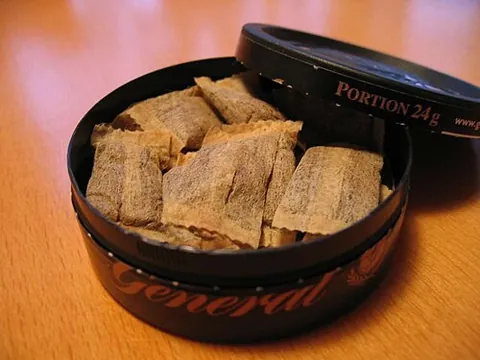 snus: a type of tobacco snuff consumed in the form of a moist powder which is placed under the (usually...